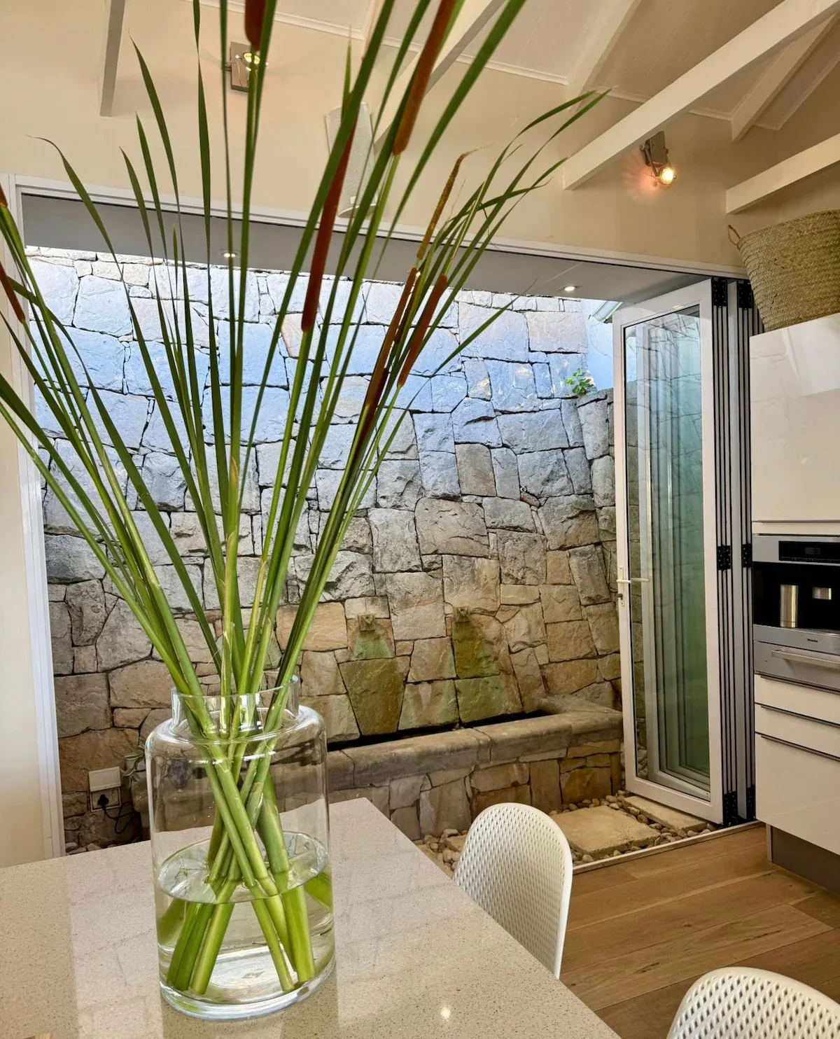 Kitchen opening onto a stone courtyard