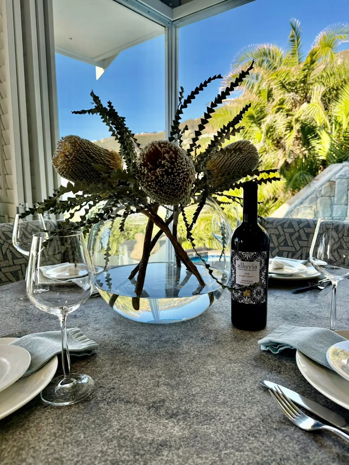 Dining table set for an evening at the villa