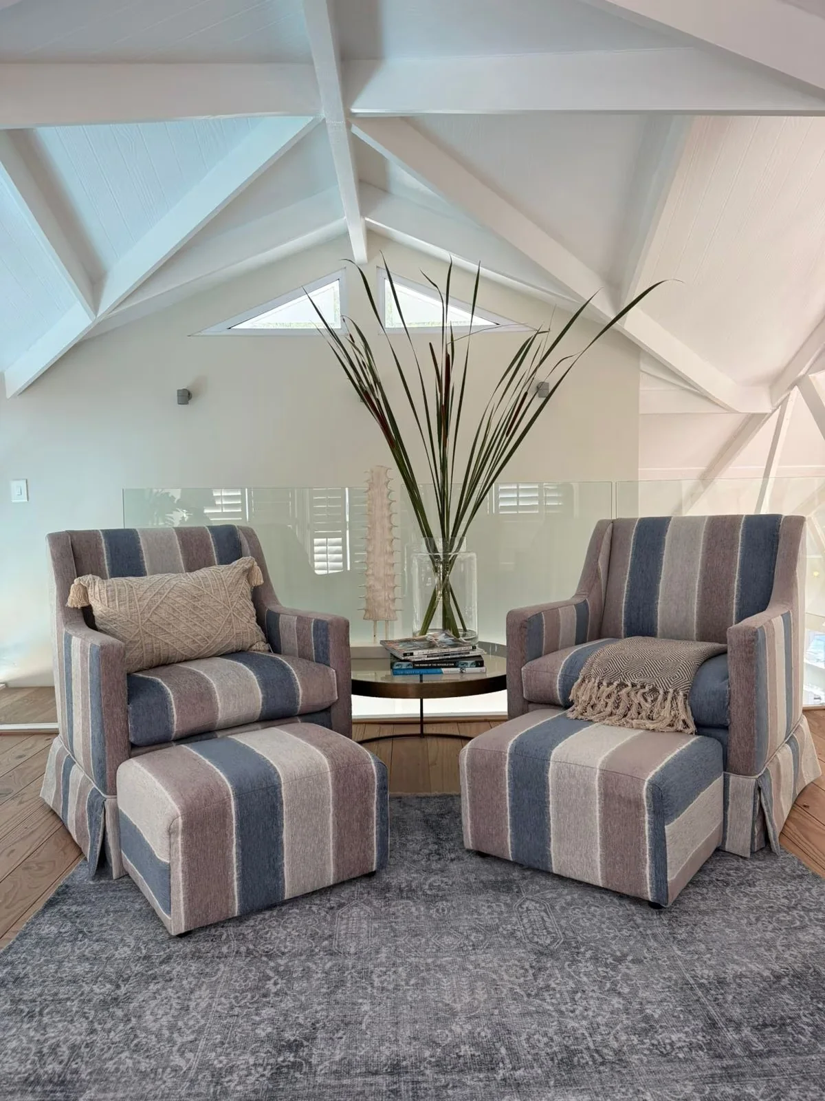 Quiet reading nook with striped armchairs