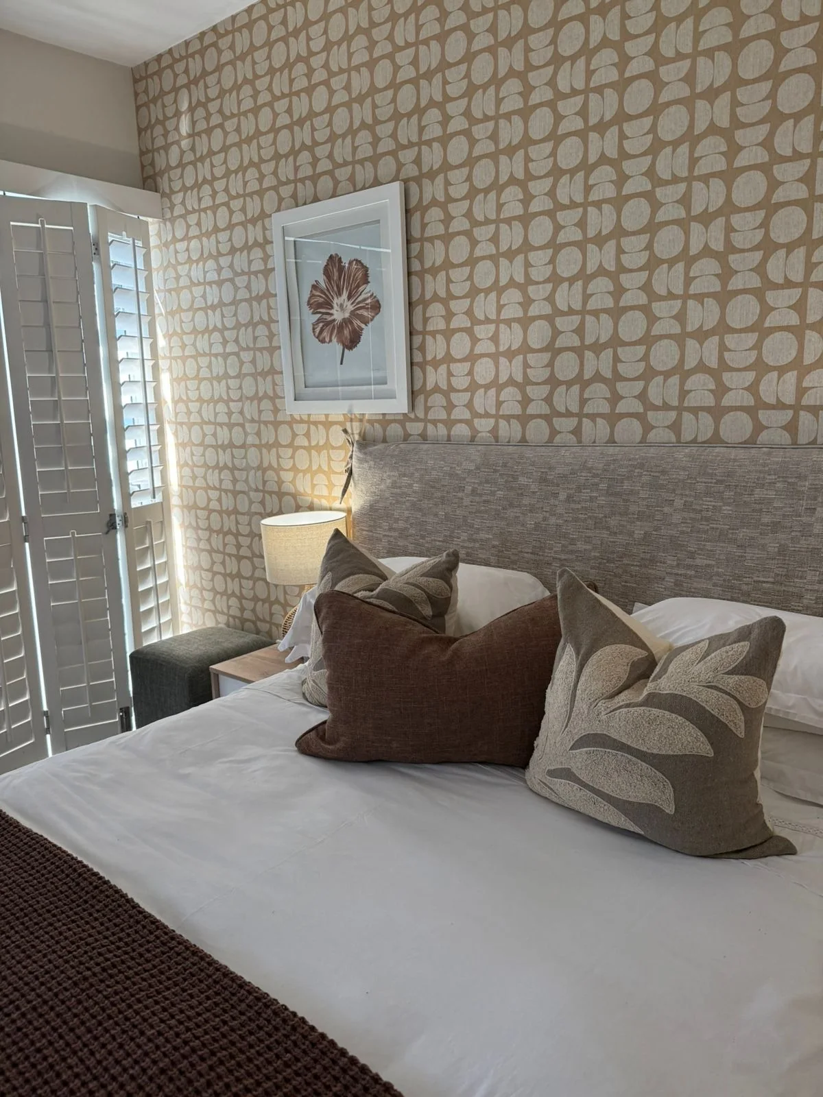 Layered cushions in a guest bedroom