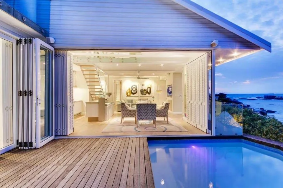 Bungalow 69 opening onto its private pool and Atlantic view at dusk