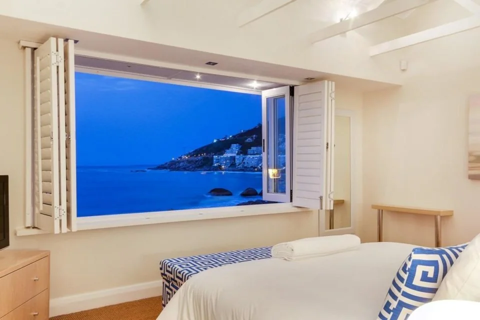 Bright bedroom at Bungalow 69 with a wide view across the Atlantic